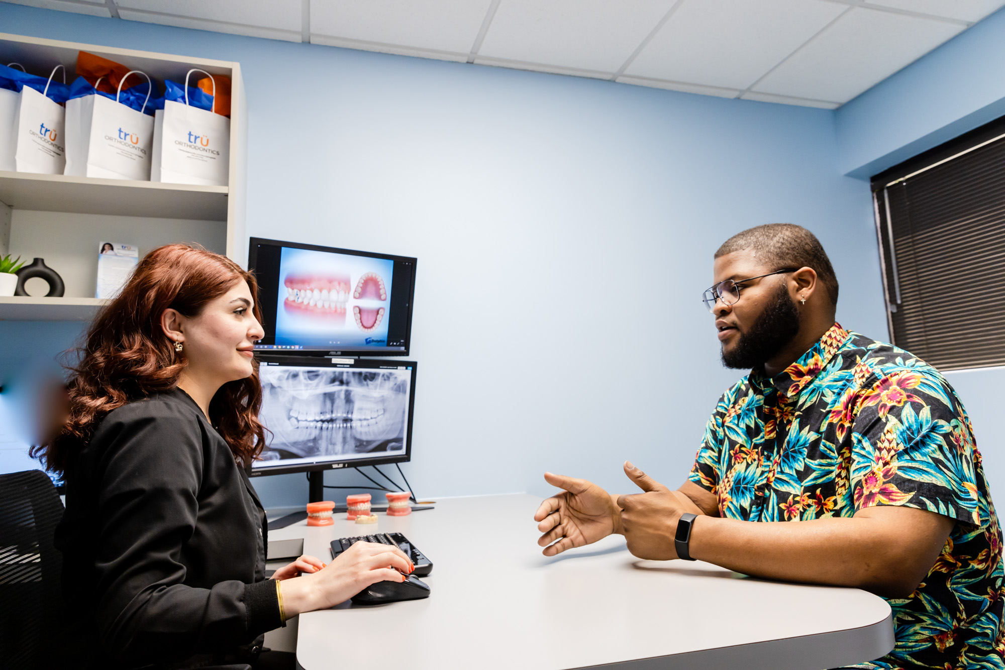 Patient discussing orthodontics in Herndon with our orthodontist.