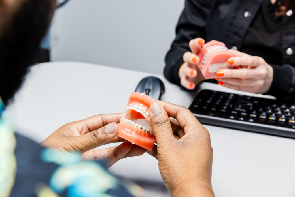 Patient observing what adult braces look like.