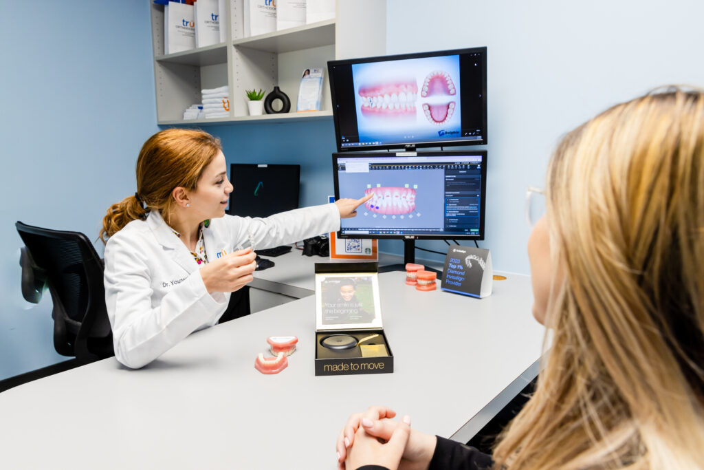 Orthodontist in Springfield talking to a patient about Invisalign.