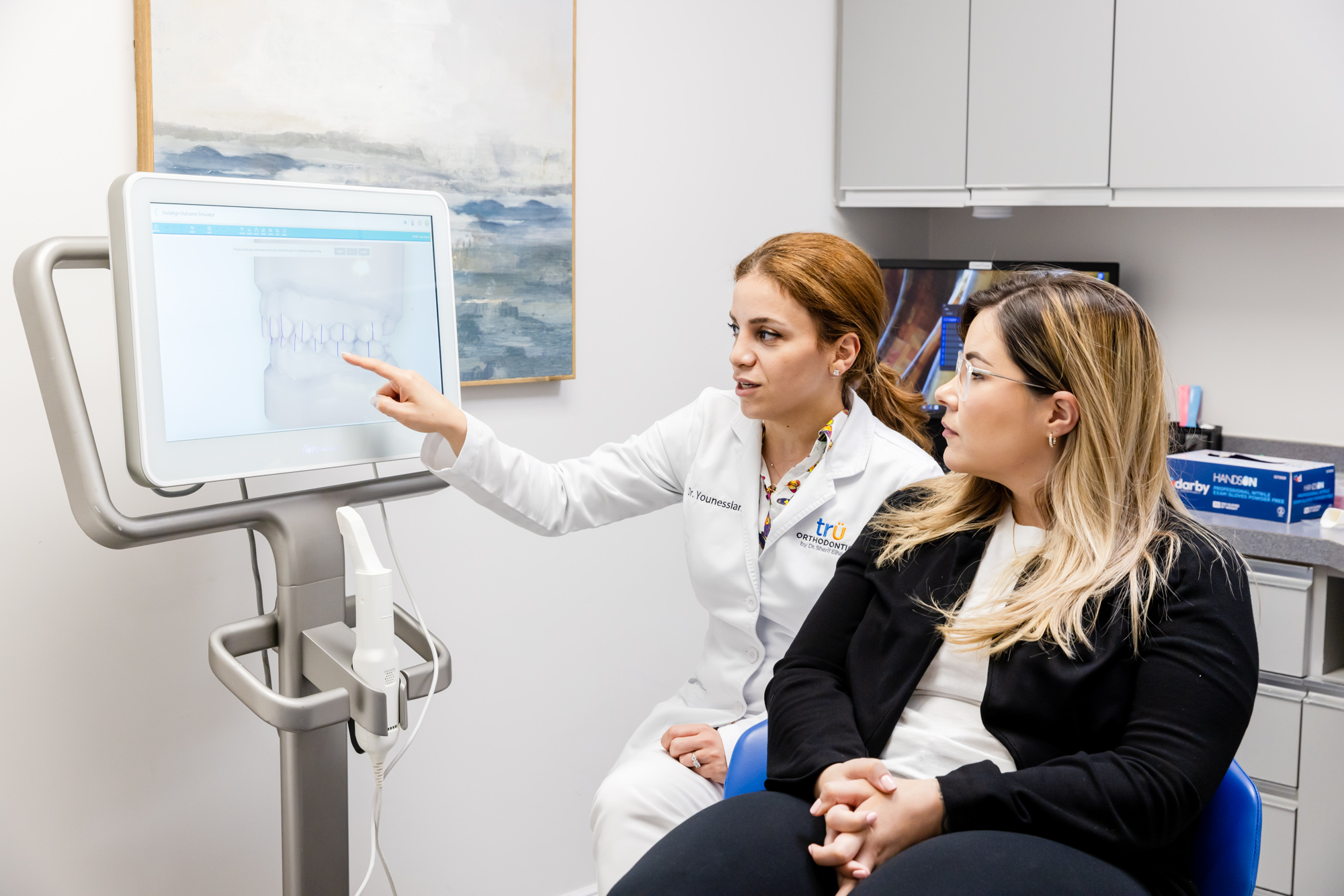 Orthodontist in West-Springfield, talking to a patient about orthodontic treatments.