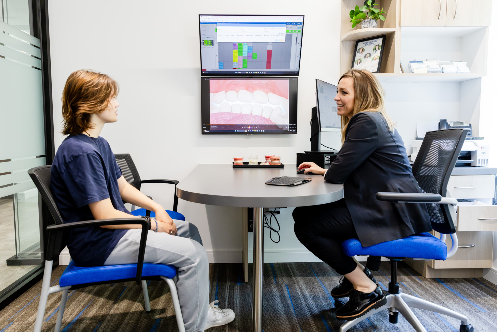 Orthodontist consulting a patient about clear aligners in West Springfield